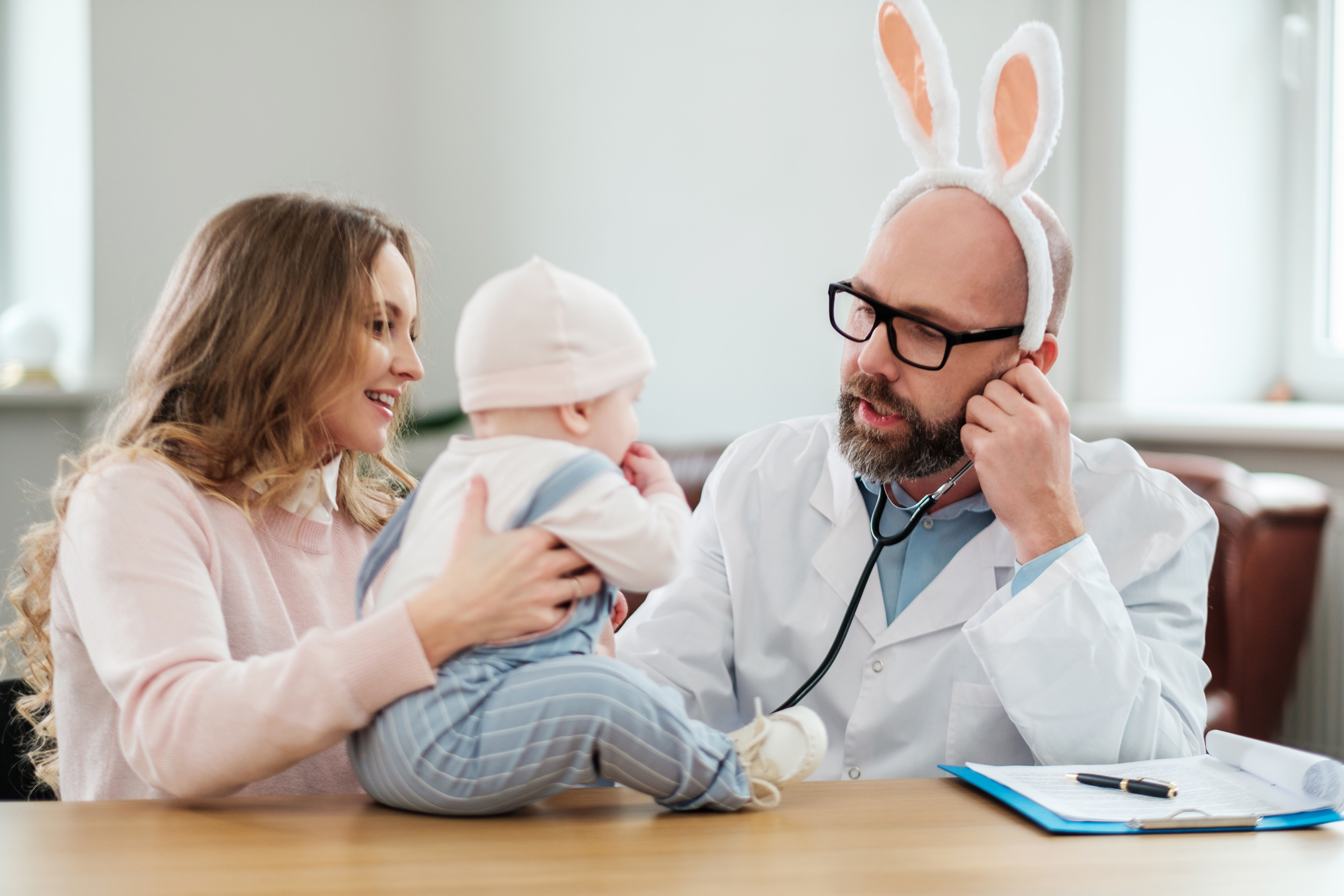 Doctor with hare ears treats a child