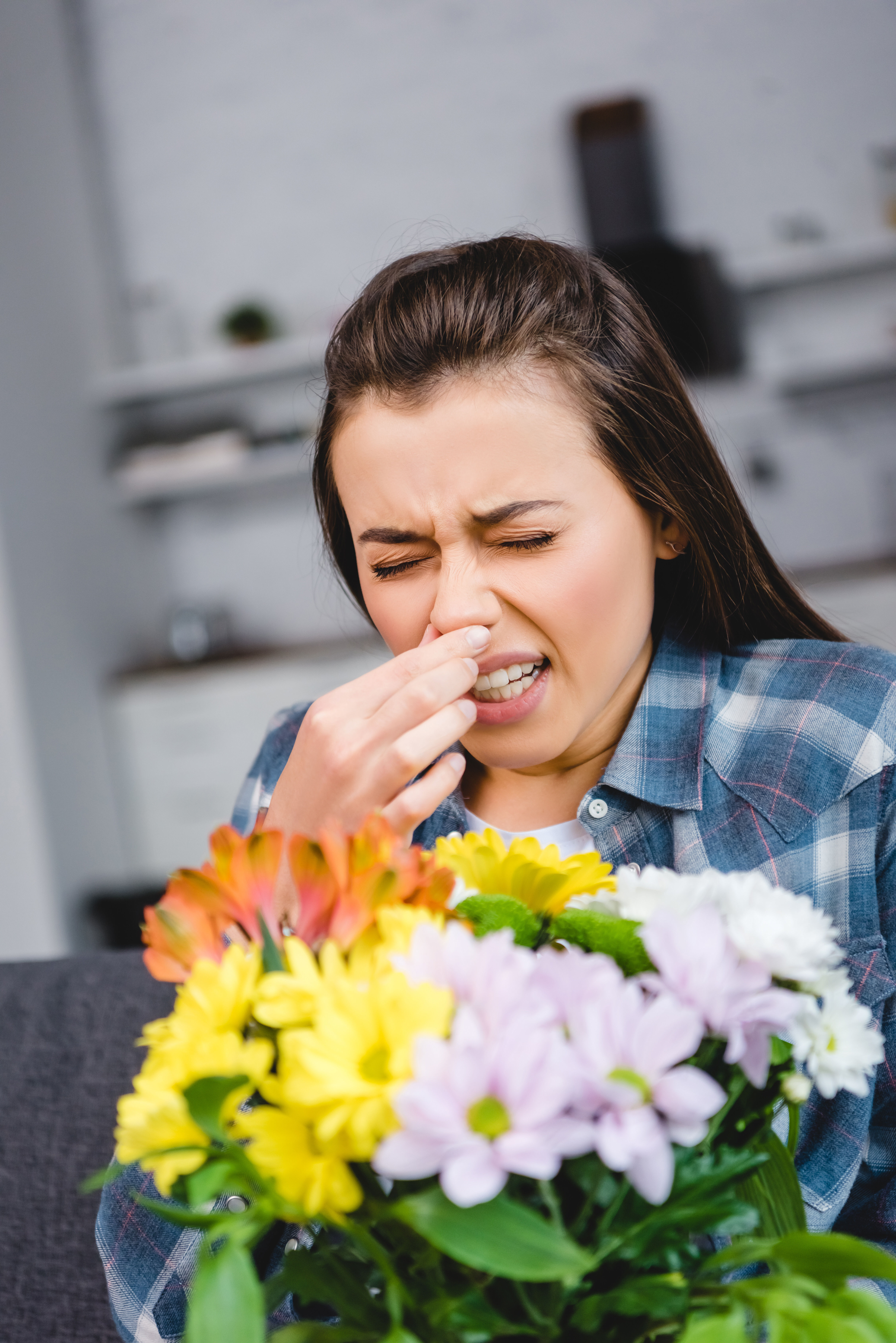 Girl sneeze from flowers