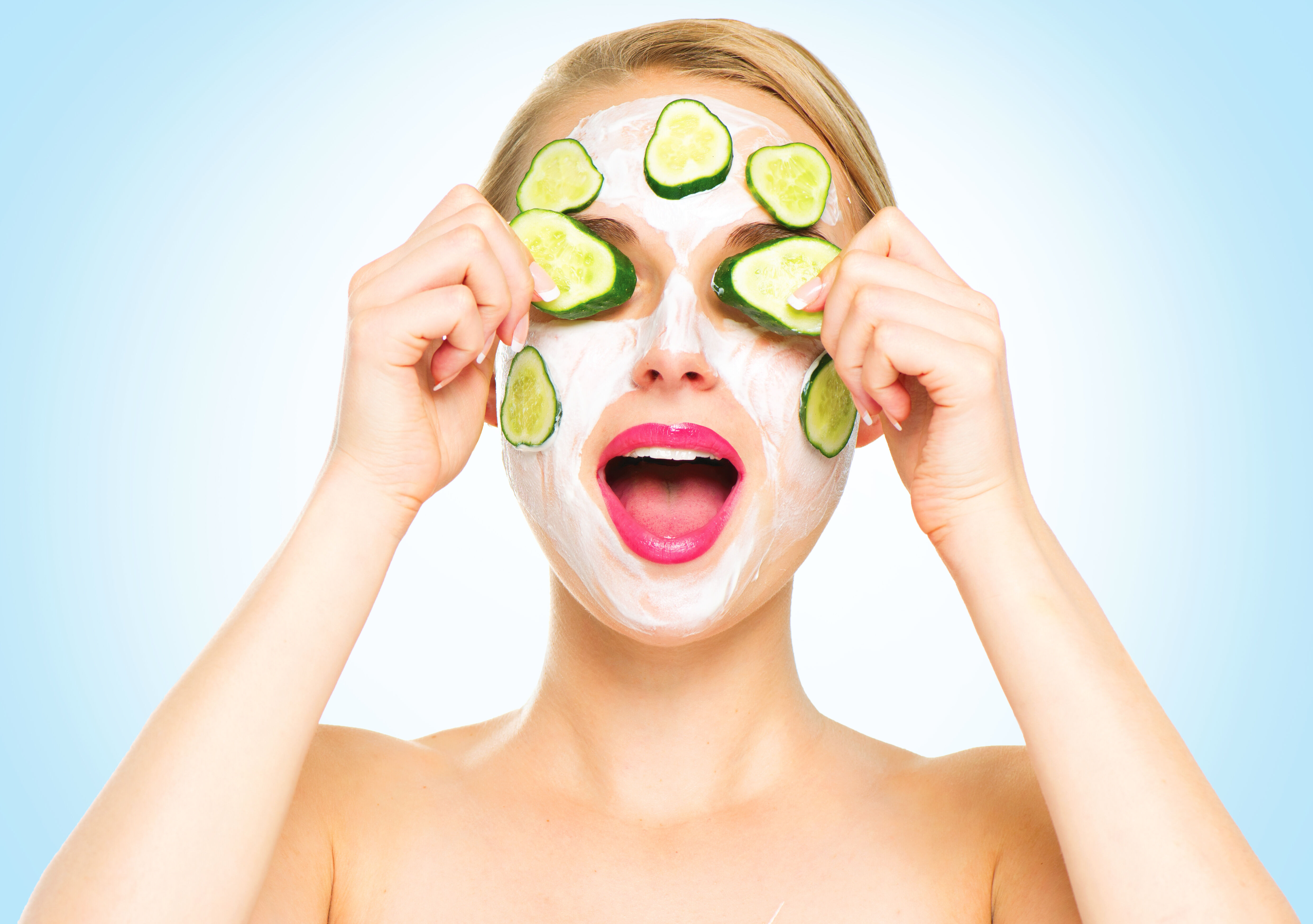 Girl with cucumbers in her eye