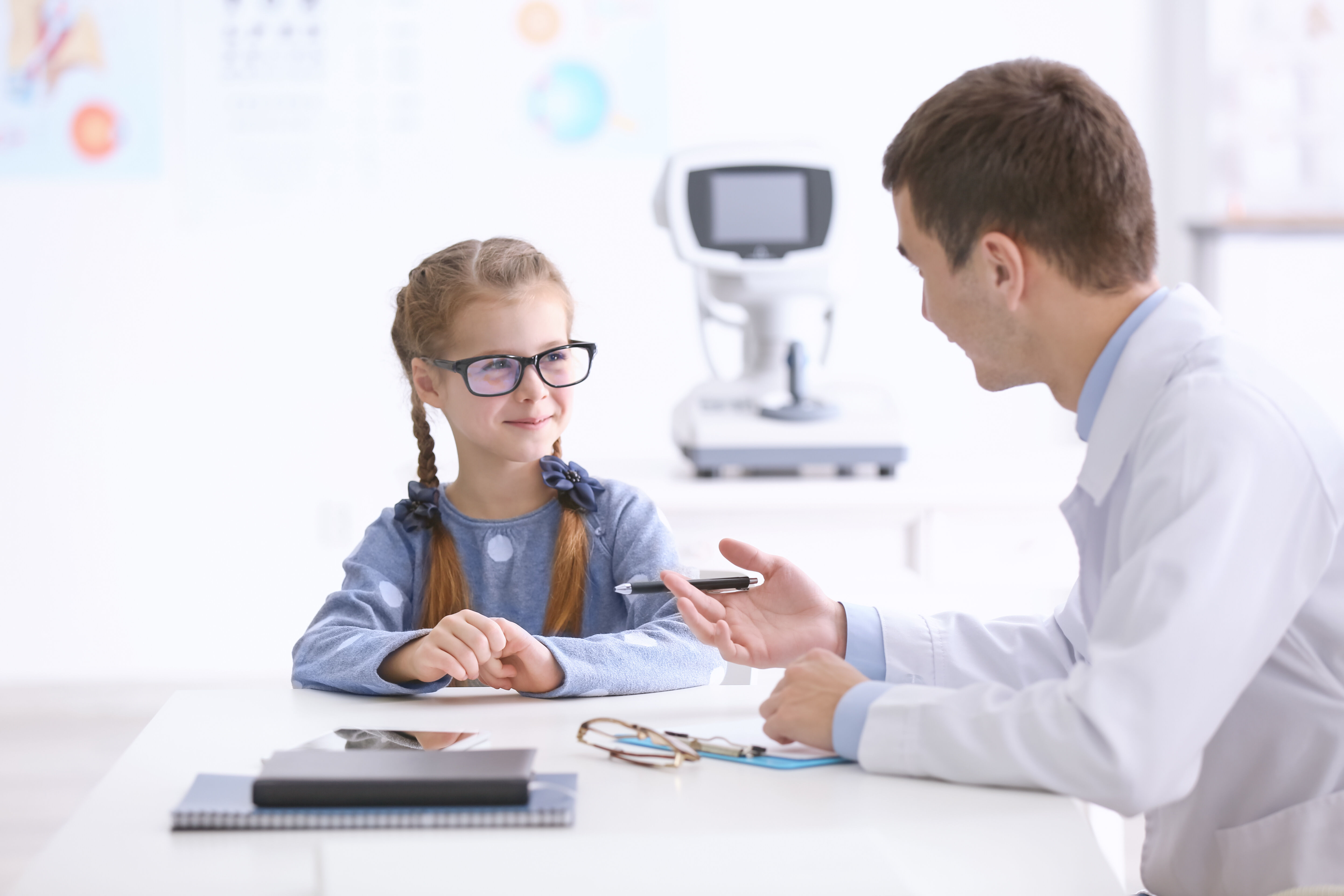 Girl with glasses with a doctor