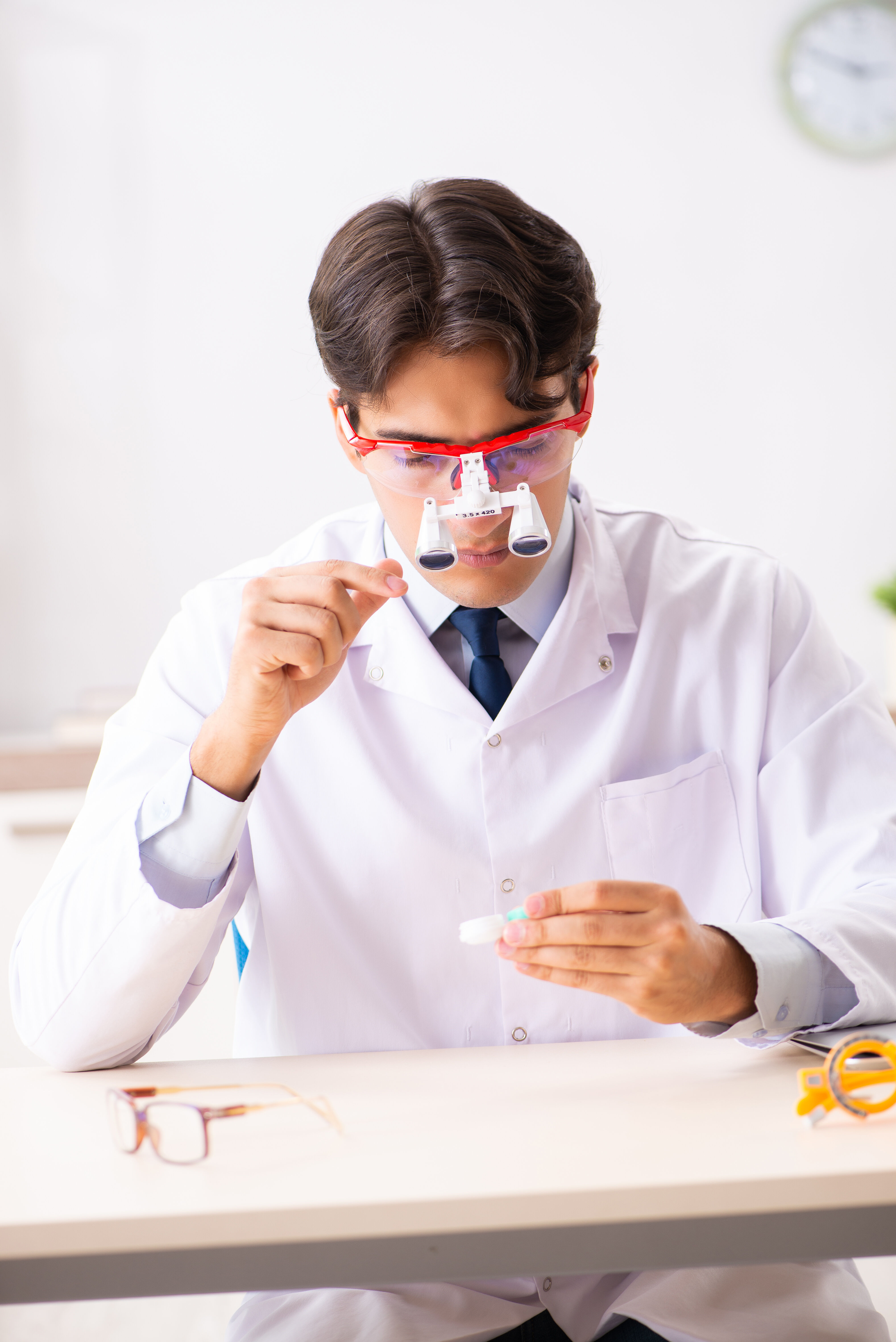 An ophthalmologist looks at the lenses