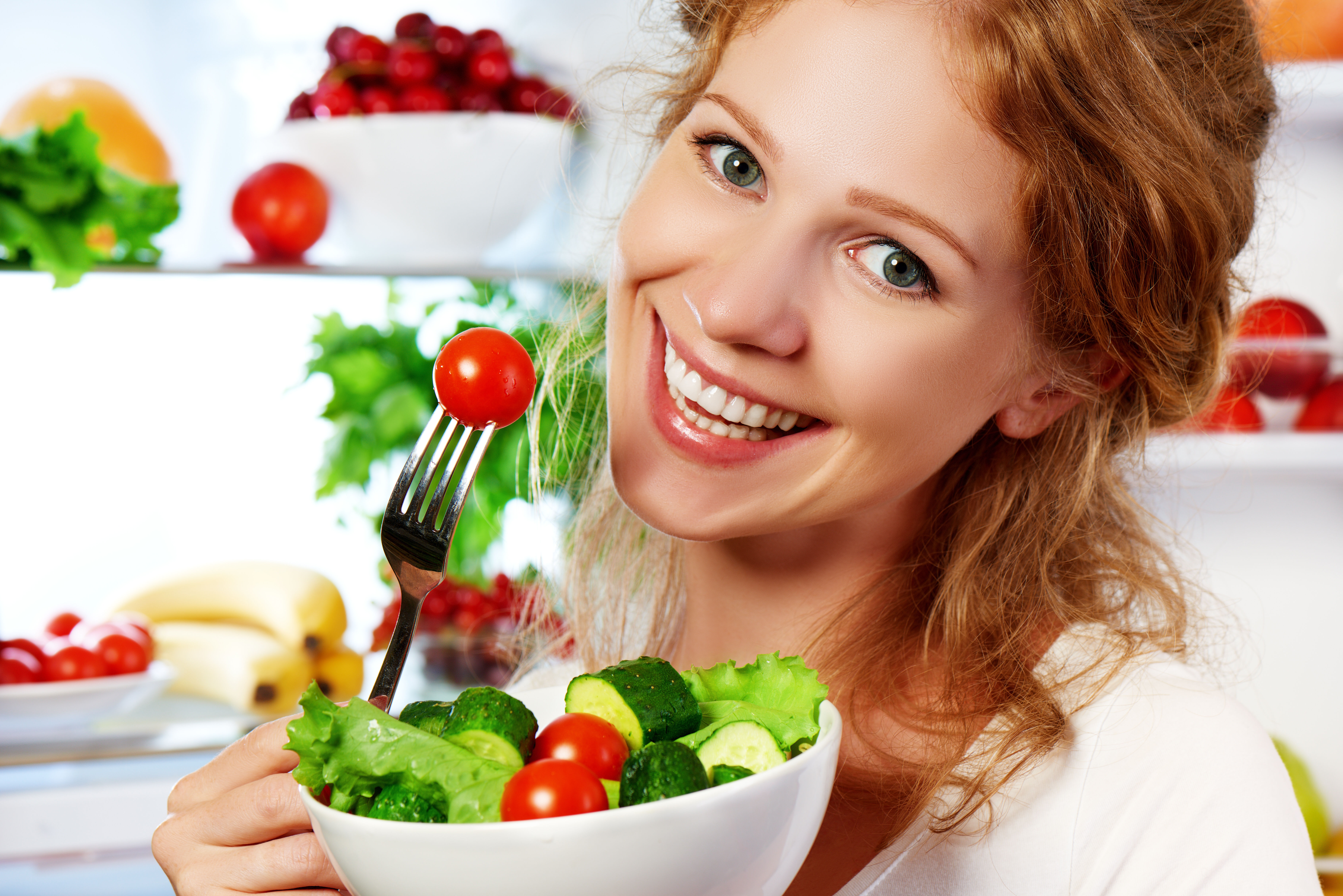 Woman eating vegetables