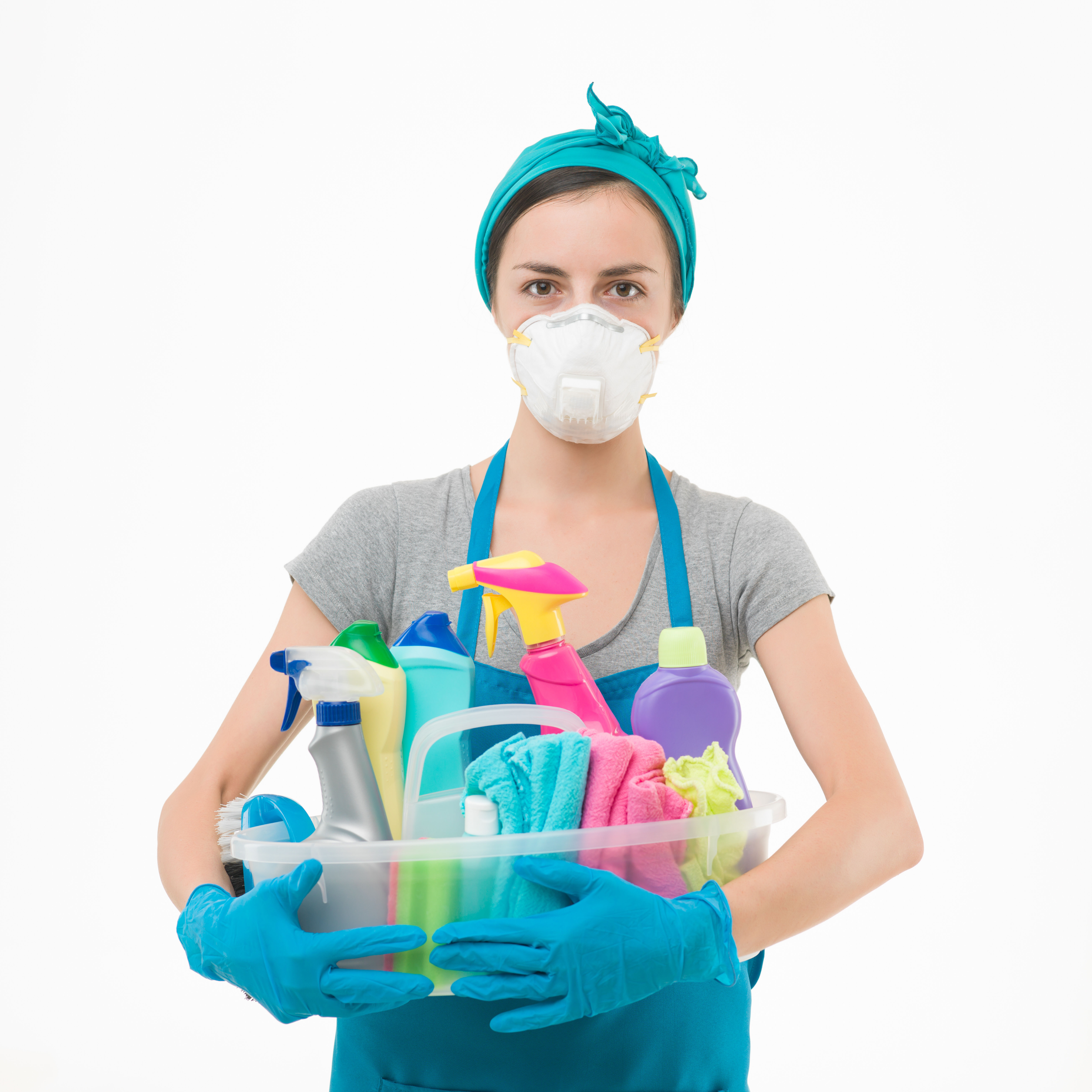 Woman holding cleaning supplies