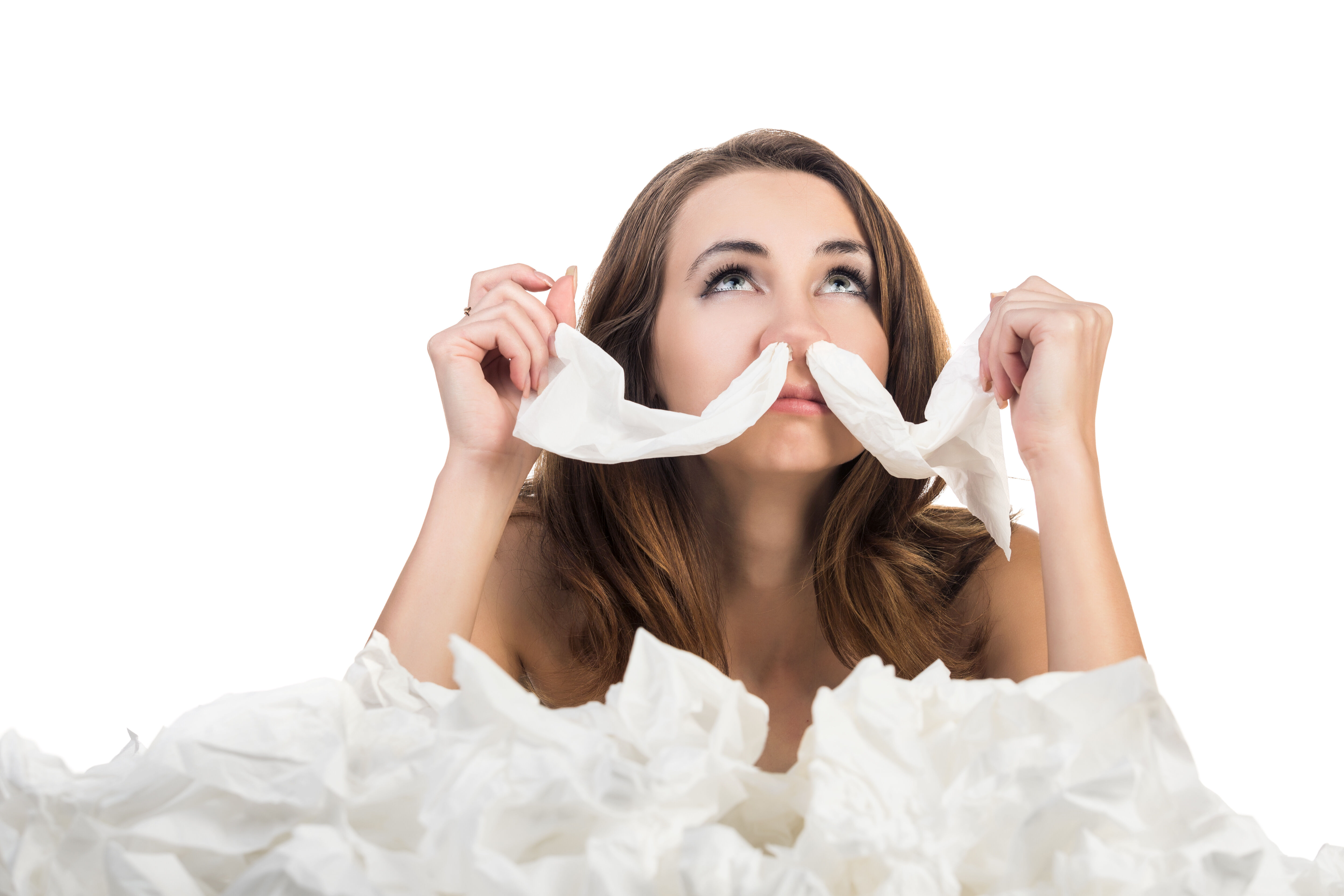 Woman with napkins in her nose